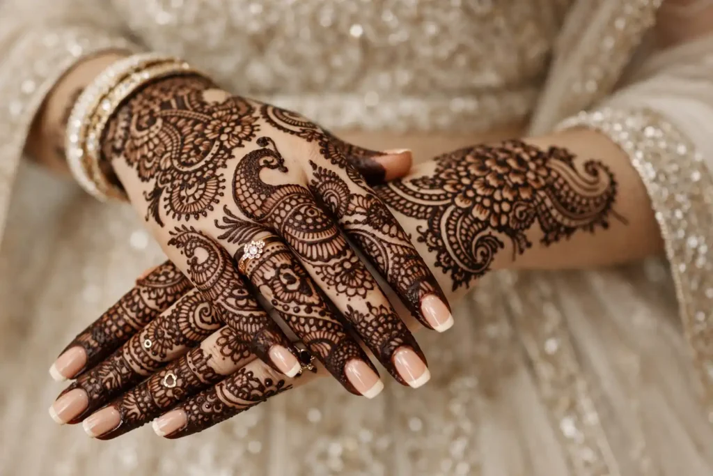 Intricate bridal mehndi design in hand with paisley and floral patterns