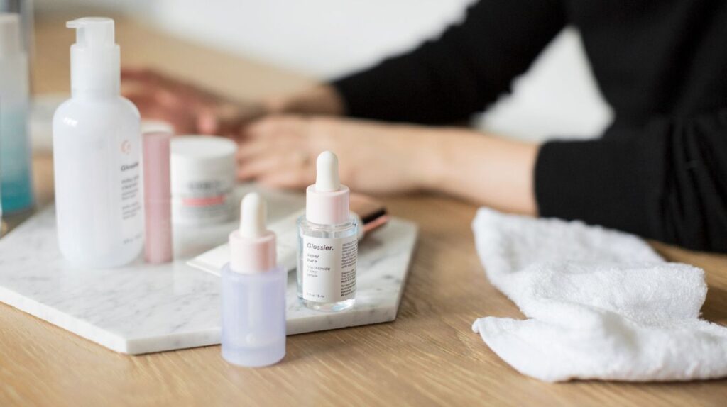 Beginner morning skincare routine with cleanser, moisturizer, and sunscreen in a clean minimal setup.